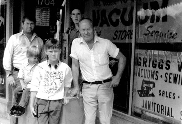 A picture from 17 years ago in front of the Griggs Vacuums storefront at the former location (1704 W. Colorado Ave.) 
shows Paul Griggs (front, right), his son Dwight (far left), and Dwight�s sons Allen (rear), Aaron (front) and Adam. 
Courtesy of Dwight Griggs
