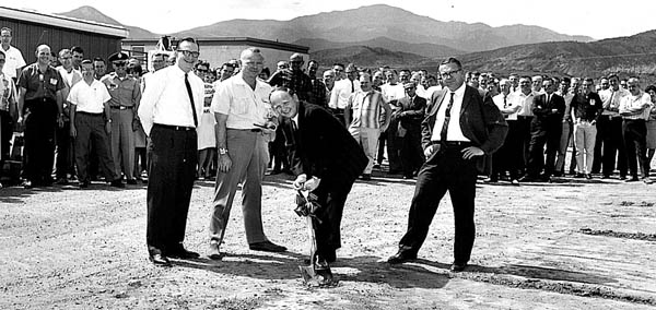 Al Bridges (with shovel) breaks ground for Kaman Sciences�
Building 3 in about 1963. Standing with him are (from left) 
co-executives John Hoffman, Phill Jessen and Frank Shelton. Buildings 1 and 2 are at the left rear.
Courtesy of Albert Bridges