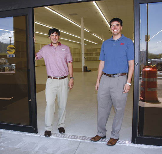 With the remodeled, currently empty store space behind
them, Nick (left) and Kirby Kuklenski stand next to the new
sliding glass door that will ease entry to their new Ace Hardware at the Uintah Gardens shopping center.
Westside Pioneer photo