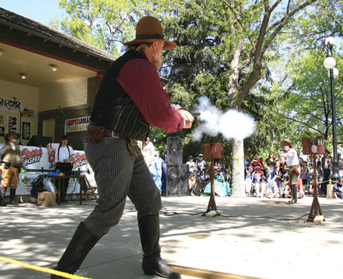 Territory Days scenes... Tim Red Matz (foreground) out-shoots Ralph Melfi to win the Fast Draw competition in Bancroft Park. 
Westside Pioneer photo