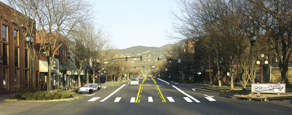 An edited photo looking west on Colorado Avenue from
24th Street imagines a two-laning through Old Colorado
City. In Manitou Springs, the center lane is used for turns
and delivery vehicles. Note extra room between parked
cars and traffic, which could ease parking or serve as a
bicycle lane.
Westside Pioneer photo and graphic