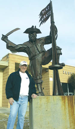 Charles Green stands beside the sculpture of Pike
Elementary's pirate mascot that he created in 1993. Green
was an original Pike student when it opened in 1956, and
his three children also went there.
Westside Pioneer photo
