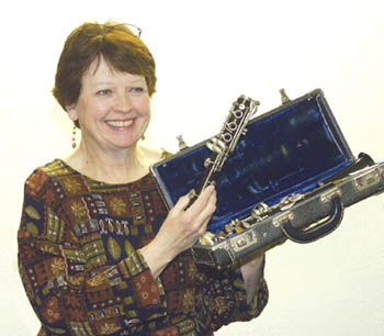 Old Colorado City Library worker Dustie Flynn holds up a
clarinet that might need refurbishing. She hopes patrons
with possibly neglected instruments will bring them to 
the Feb. 11 Instruments in the Attic.
Westside Pioneer photo