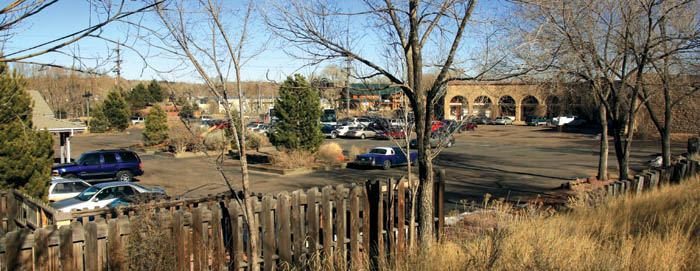 The Midland roundhouse (now Van Briggle Pottery) is at far right, with its parking lot going west to the planters, which 
mark the start of the Ghost Town property (a corner of the the latter�s building is at far left) Photo looks northeast, with the Highway 24/21st Street intersection 
beyond.
Westside Pioneer photo