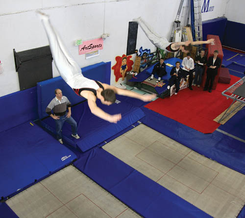 Synchronized trampolinists Tim Rohlfing (left) and Philip Gifford perform during an ArtSports event Feb. 9 that also 
featured potential Olympics qualifier Logan Dooley.
Westside Pioneer photo