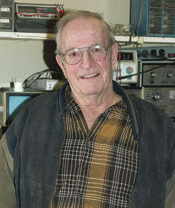 Skip Sherbak poses with some of the tools of the trade in his TV repair shop.