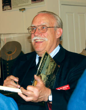 Local historian Mel McFarland signs a copy of one of his two books on the Midland Railway after his talk at the Old 
Colorado City History Center Feb. 16
Westside Pioneer photo