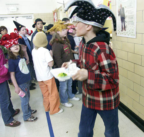 Midland Elementary fifth-grader Milo Abrams-Hickman heads for a lunch table with his order of green eggs and ham 
March 2 as part of a Dr. Seuss celebration (note: it was also crazy hat day at Midland.
Westside Pioneer photo
