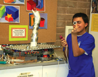 Zac Souza displays his �Pandora�s Box� project.
Westside Pioneer photo