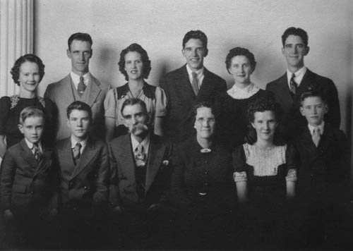 A photo taken in 1942, just before young Fred went into the service, also shows his parents and siblings. Back row (from 
left): Ila, Delbert, Edna, Ed, Alma and Fred Jr. Front row (from left): Tilman, Ray, Fred Sr., his wife Lilley, Twila (she and Ray were twins) and Cleo.
Courtesy of Fred Bishop
