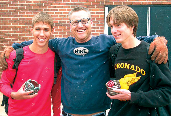 Amid snowfall, chemistry teacher Darin Smith with his chemists (potters for a day) John Slane, left, and Andrew Lesser.  
Courtesy of Sue March