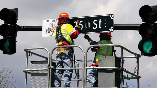 With approval from the boards of the Old Colorado City
merchants and the maintenance district, Colorado Springs
Traffic Engineering crews were installing historically geared signs at the intersections on Colorado Avenue April 16.
Westside Pioneer photo