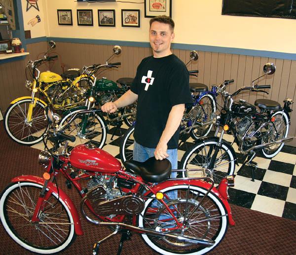 Dallas Maddox displays the five colors of Whizzer motorbikes inside his Old Colorado City showroom.
Westside Pioneer photo