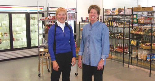Sandra Vanderstoep (left) and Holly Mervis, co-owners of 
Garden of the Gods Gourmet Market & Catering at 2528 W. 
Cucharras St., pose inside the market area.