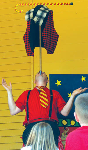 Jim Jackson demonstrated a unique way to put on a vest,
scarf and cane during a Manitou Art Theater outreach show
in Bancroft Park two years ago.
Westside Pioneer file photo