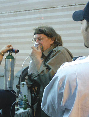 Kantner takes some oxygen beside the stage