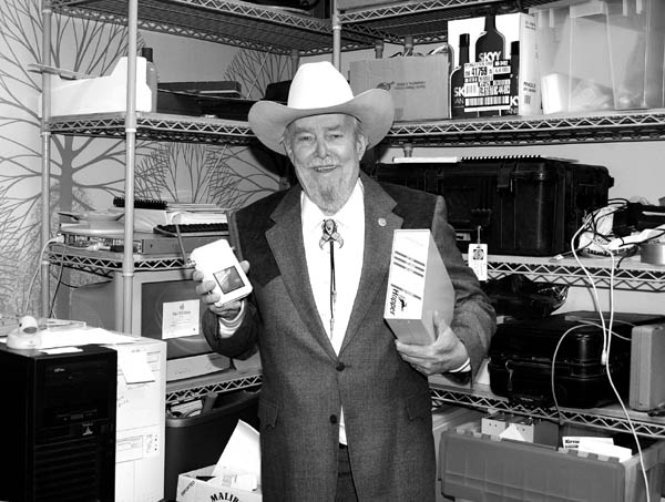 Dave Hughes displays a couple of telecommunications devices.
Westside Pioneer file photo
