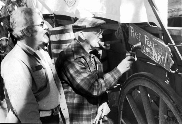Gene Brent (left) watches Scotty Price use a gun butt to
hammer in a sign during the 1976 Territory Days. Brent
credits Price with suggesting the Old Colorado City �territorial� angle in 1975. 
Courtesy of Gene Brent