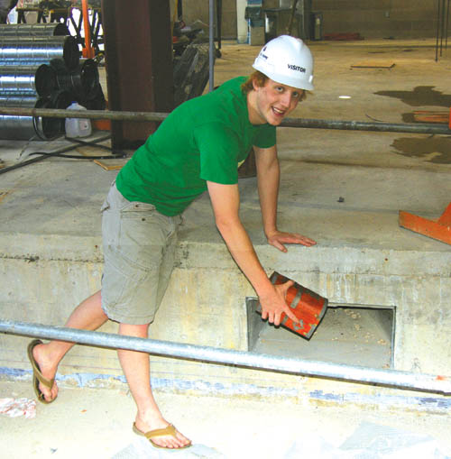 Shh! It�s a secret! Coronado High senior Andrew Ives
shows where a nook was created for the time capsule on
one side of the new auditorium�s stage.
Westside Pioneer photo