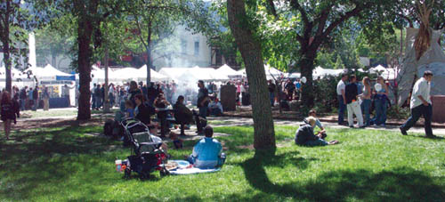 A placid view Sunday afternoon from Bancroft Park toward Colorado Avenue, where smoke wafts up from festival eateries.