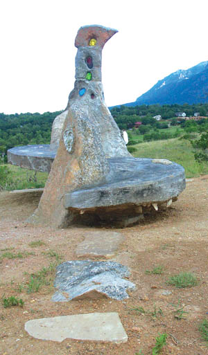 With flagstones in the foreground, the recently completed 
concrete couch can be seen at an overlook in Bear Creek
Regional Park. Many of the stones have sayings on them. 
Can you find the sculpted face?
Westside Pioneer photo