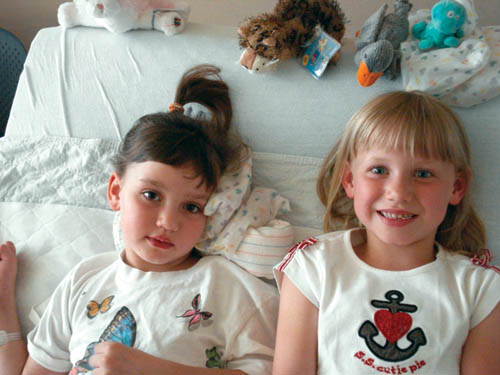 Lily Griesan (left) and her twin sister Valerie are shown during Lily�s recent stay at Children�s Hospital in Aurora.
Courtesy of the Griesan family