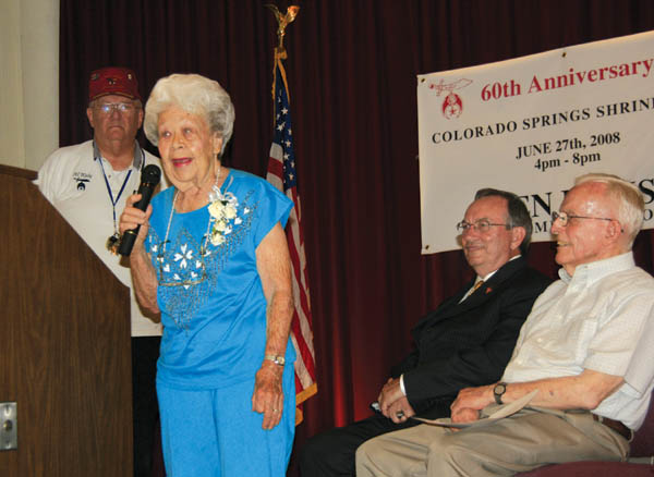 One-time Arensdale School student Crystal Rhodes recalls
some history during the Colorado Springs Shrine Club�s 60th
anniversary celebration June 27 on the stage at the club
(and former Arensdale site). Listening are (from left) club
President Richard Hanson, Colorado Springs Vice Mayor Larry Small and Gene Current (also a former Arensdale student).
Westside Pioneer photo