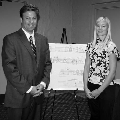 Two of the Pinery leaders at the Aug. 12 neighborhood
meeting � Eric Allen and Dani Silvestro � pose with drawings that show how the planned wedding event center on the Bijou Street Hill would look.
Westside Pioneer photo