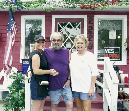 Andrea Hill (right) stands by the front steps to the
family-owned Mountain Shadows Restaurant that she and her husband, Ray, operate with help from Ray's daughter, Tara
Westside Pioneer photo