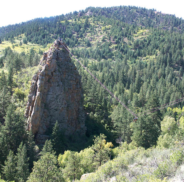 Traversing with a carabiner, a competitor readies for a hillside landing during an 
�adventure race� in Bear Creek Park Sept. 27.
Westside Pioneer photo