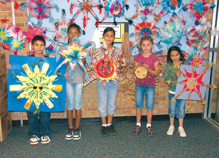 With classmates� work on the same project as a backdrop,
Jackson Elementary art students (from left) Felix Gutierrez,
Kali Peltier, Alondra Serna, Gabrielle Hemphill and Marlie Groshans hold up their work.
Westside Pioneer photo