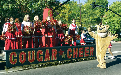 The Coronado cheerleaders float with Cougar mascot
Westside Pioneer photo