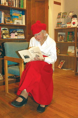 In typical style, Edna Pooler was dressed in her Christmas
best last December while volunteering as a greeter at the
Old Colorado City History Center during the annual Bed
& Breakfast Holiday Tour.
Westside Pioneer photo