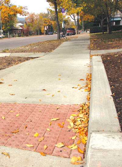 A pedestrian ramp, with a �dimpled� surface at the base (to
help a blind person recognize a street crossing) was recently installed by a Mountain Metro contractor at
Colorado Avenue and 13th Street. Similar ramps are going in along both sides of the avenue between 8th and 31st
streets as part of a federally funded project to make the bus company�s Route 3 more handicapped-accessible.
Westside Pioneer photo