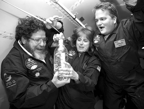 Weightless inside a Boeing 727 Oct. 20, West Middle
Schools Ranganath Weiner (left) implements the Cartesian
Divers experiment with  Lois Vavra of Russell Middle School
and Tom Henson of the Northrup Grumman Foundation.
Courtesy of Northrup Grumman