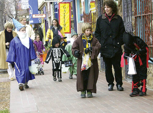 Unfazed by the days chill, a flock of young trick-or-treaters
looks for the next candy location along the south side of
Colorado Avenues 2400 block during the annual Halloween Safe Treats in Old Colorado City Oct. 31.
Westside Pioneer photo