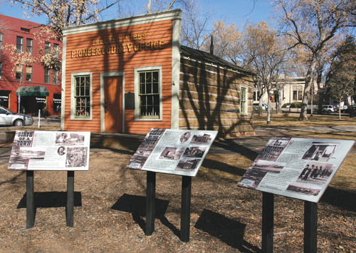 City Parks developed the information boards about (Old)
Colorado City and Bancroft Park�s Garvin Cabin that are in the foreground. In the background, on the near (east)
side of the cabin, the Old Colorado City Historical Society plans to erect a perrmanent, eight-sided granite monument
� in conjunction with the sesquicentennial celebration � that will explain the history of early El Paso County and Colorado City.
Westside Pioneer photo