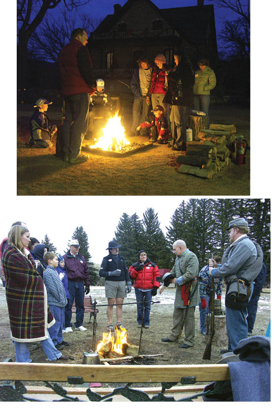 TOP: With the Rock Ledge House as a backdrop, visitors to
the Dec. 16 Holiday Evenings event at Rock Ledge Ranch
Historic Site toast marshallows or just warm themselves in
general  next to one of several bonfires that had been 
prepared on the site for that purpose. 
RIGHT: Bob Johnson of a Civil War Confederate
reenactment group removes his hat during a presentation
as part of Holiday Evenings. A contemporary message was
that soldiers then and now miss their families during wartime
Westside Pioneer photos